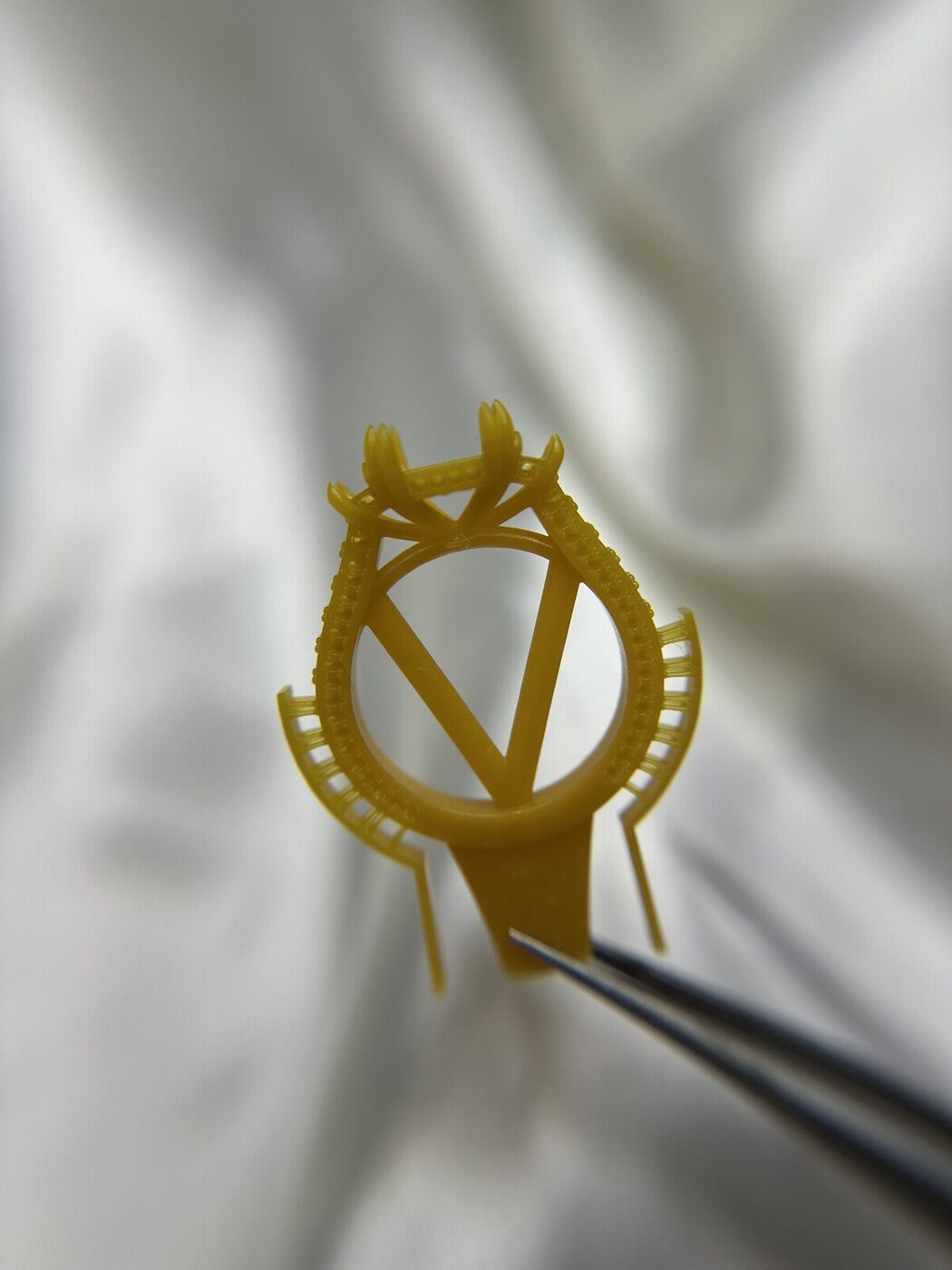 Yellow 3D printed wax model for a custom ring